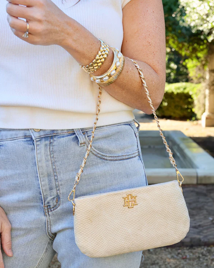 Livi Shimmer Champagne Crossbody Handbags in at Wrapsody