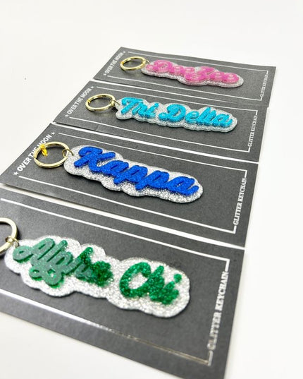 Glitter Keychain Greek in  at Wrapsody