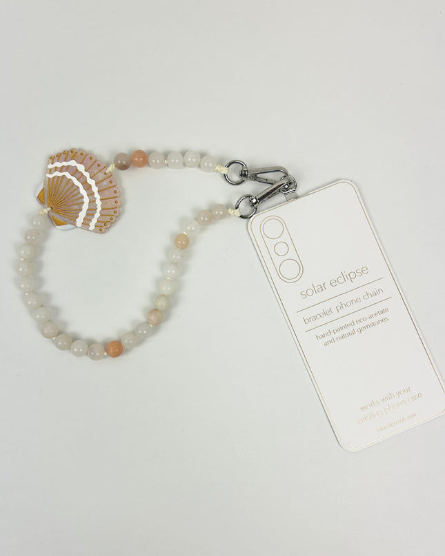 Solar Eclipse Seashell Phone Chain Bracelet Travel Accessories in at Wrapsody