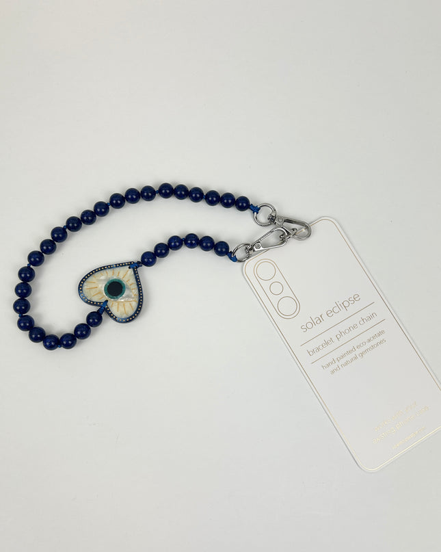Solar Eclipse Coastal Lucky Eye Phone Chain Bracelet Travel Accessories in at Wrapsody