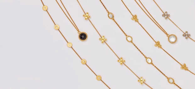 Julie Vos Necklaces laid out on a table