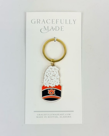 Auburn Band Hat Enamel Keychain Travel Accessories in  at Wrapsody